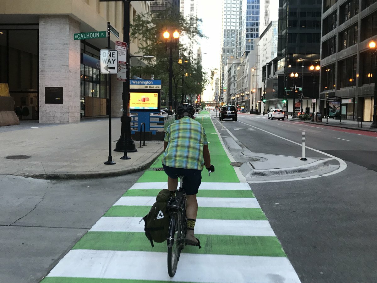 Green Paint on protected bike lanes on Milwaukee (Western to California)